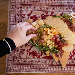 34° crisp held in hand showing thin size and easy portability