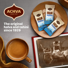 Hand holding Achva halva mini to show scale and easy single-serve portability