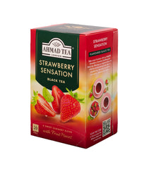 Ahmad Tea close-up of strawberry pieces and tea leaves, emphasizing natural ingredients