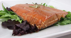 Alaska Smokehouse smoked salmon served on crackers offering easy entertaining idea