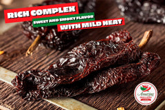 Amazing Chiles & Spices finely ground ancho powder in spoon, highlighting fresh homemade spice benefit