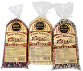 Amish Country Popcorn front packaging showing three one‑pound bags, clear labeling and colorful kernels
