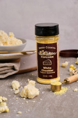 Amish Country Popcorn white cheddar close-up showing fine cheese powder benefit