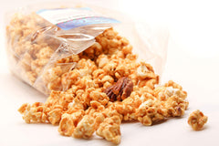 Amish Good caramel glaze close-up on popcorn, highlights glossy handmade coating