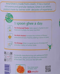 AMUL ghee on spoon over stovetop demonstrating high-heat cooking performance