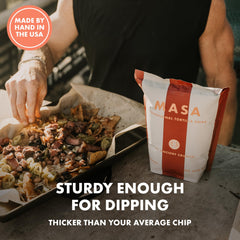 Ancient Crunch MASA Cobanero chips dipped into guacamole for bold flavor