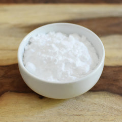 Open 2 lb bag of Anthony's erythritol next to measuring cup for accurate portions