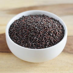 Anthony's seeds sizzling in pan to show tempering technique that boosts flavor