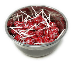Assortit cherry Tootsie Pops in bowl at party setting for easy guest distribution
