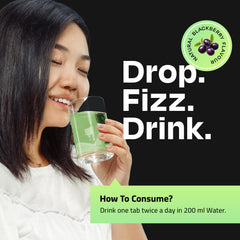 Auric LIV365 Green tablet fizzing in a glass illustrating instant refreshment