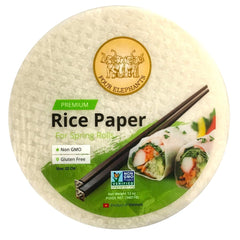 Authentic Asian Pantry rice paper and Mae Ploy sauce on table with rolls, demonstrating easy roll assembly