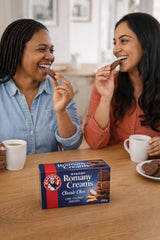 BAKERS Romany Creams cookie held in hand showing size and convenient snack benefit
