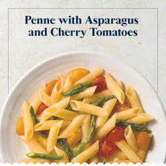 Barilla penne tossed in tomato sauce showing shape capturing sauce and flavor