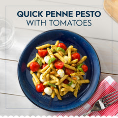 Barilla pouch opened with penne visible ready to heat and serve
