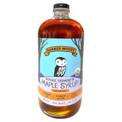 Barred Woods quart bottle front view showing label and clear amber syrup