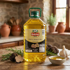 Basso drizzling over pasta in kitchen, emphasizing enhanced flavor and presentation