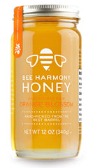 Bee Harmony front label showing orange blossom honey and clear glass jar for transparency