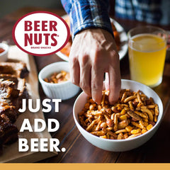 BEER NUTS ingredient spread on wood table showing mix variety
