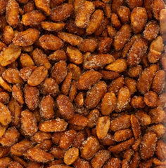 Belmont Peanuts size comparison in hand showing extra-large Virginia peanuts and substantial bite