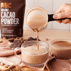 BetterBody Foods cacao blended into chocolate smoothie for creamy flavor boost