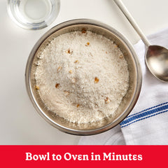 muffin batter being poured into tin from Betty Crocker mix for quick baking