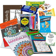 Beyond The Box activity books spread open to puzzles and coloring pages, providing quiet engagement