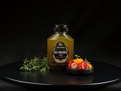 Boar's Head dressing being drizzled over salad for quick flavorful serving