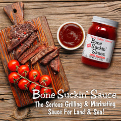 Bone Suckin' glazed ribs on a platter showcasing sticky, caramelized finish and flavor