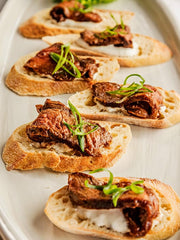 Bourbon Barrel Foods sauce spooned over tenderloin showing enhanced savory flavor