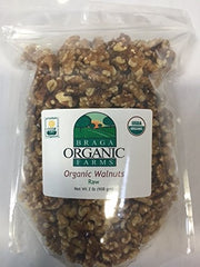 Braga Organic Farms walnuts held in hand showing scale and generous kernel size