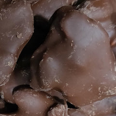 Brittle Brothers piece beside coin for scale illustrating portion size