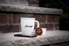 Brooklyn Beans brewed caramel coffee cup showing creamy color and aroma