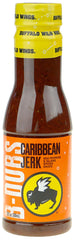 Buffalo Wild Wings sauce pouring from bottle, glossy jerk glaze adds visual appeal and sticky finish