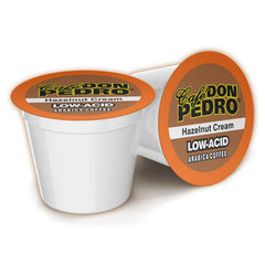 Cafe Don Pedro front packaging showing hazelnut pods and benefits