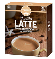 Café TASTLÉ served vanilla latte in porcelain cup illustrating rich foam and aroma