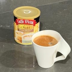 Caffe D'Vita poured hot chai latte in cup showing creamy foam and comforting warmth benefit