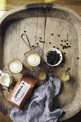 CAFFÈ UMBRIA close-up of whole beans highlighting roast color and texture, suggests quality