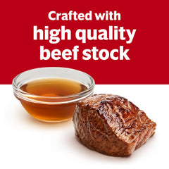 Prepared beef consommé poured in bowl, Campbell's gives warm savory comfort