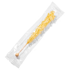 Candy Envy stick placed in hot tea demonstrating slow sweetening and elegant stirrer