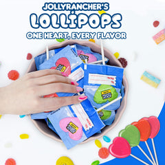 Candylish Jolly Ranchers heart lollipops on a party table in favor bags illustrating easy distribution