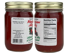 Cane River Mayhaw Jelly open jar with spoon highlighting smooth texture and spreadability