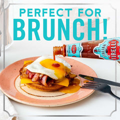 Pouring CASA FIRELLI sauce showing rich red texture and balanced heat benefit