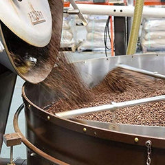 Charleston Coffee Roasters pouring grounds into French press illustrating brewing ease benefit
