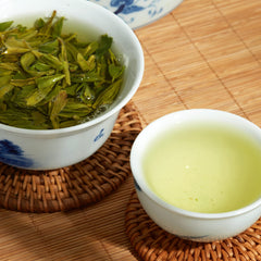 ChaWuWarmSun brewed cup top view with yellowish-green liquor for smooth taste