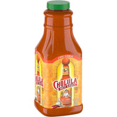 Cholula bottle front packaging showing large 64 fl oz size and brand benefit