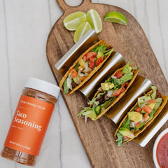 Clean Monday Meals seasoned tacos on a plate in a lifestyle shot promoting quick flavorful weeknight meals