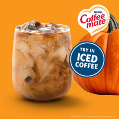 Coffee Mate creamer pouring into a coffee cup showing smooth blend and warm pumpkin flavor