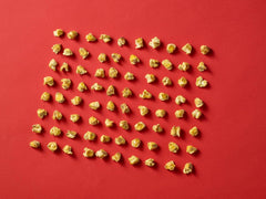 Hand holding Corn Nuts bag to show size and single-serve convenience for on-the-go