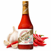 Crystal bottle front packaging showing label and garlic-enhanced cayenne flavor benefit