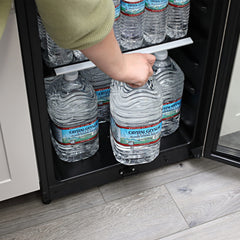 Crystal Geyser jug being poured into a glass demonstrating easy-pour convenience